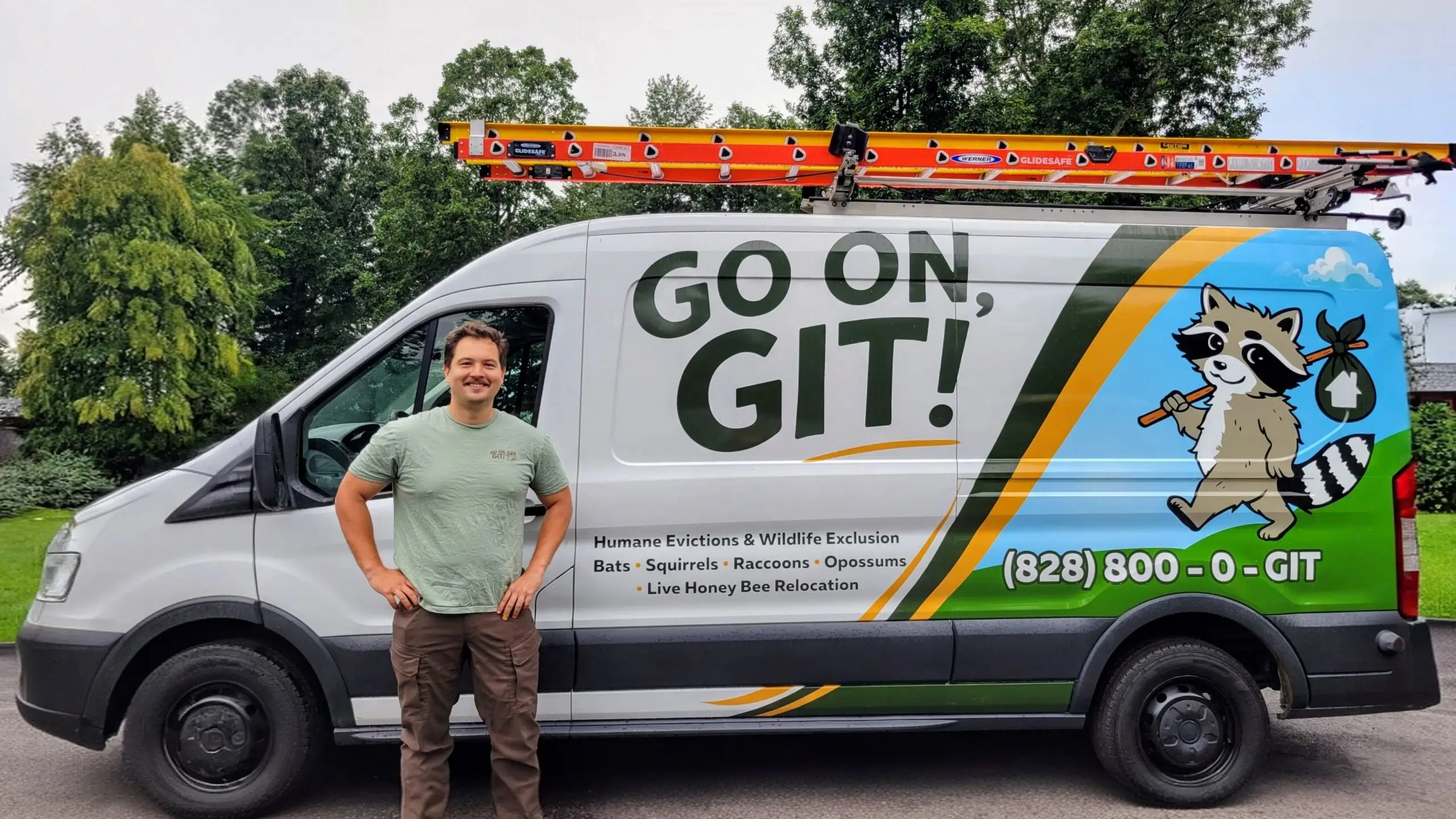 Neil, founder of Go On, Git!, in front of the fully wrapped Git Wildlife van